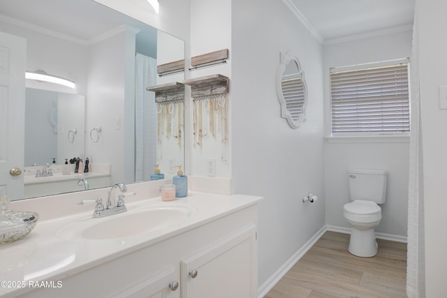 502 River Woods Dr, Lafayette, LA 70508 - full bathroom with wood finished floors, crown molding, toilet, vanity, and baseboards