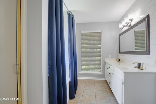 502 River Woods Dr, Lafayette, LA 70508 - bathroom with tile patterned floors, double vanity, a shower with shower curtain, and baseboards