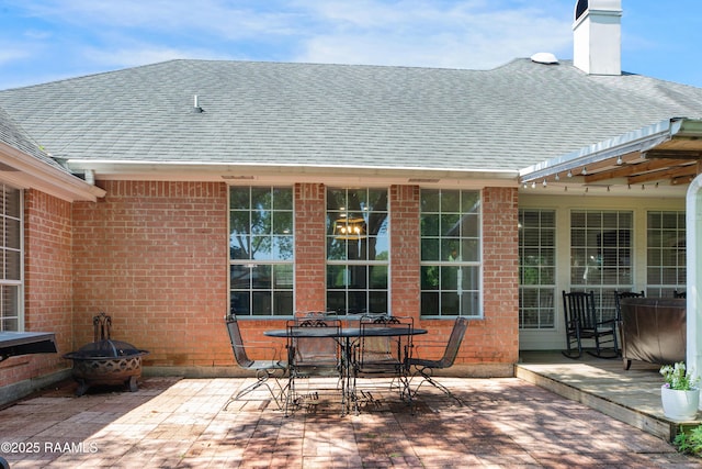 502 River Woods Dr, Lafayette, LA 70508 - view of patio featuring a fire pit and outdoor dining area
