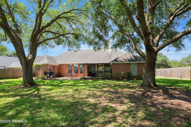 502 River Woods Dr, Lafayette, LA 70508 - rear view of property with brick siding and a patio
