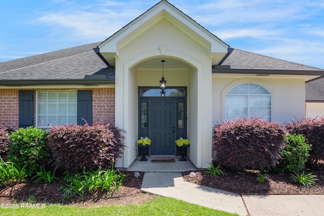 502 River Woods Dr, Lafayette, LA 70508 - view of exterior entry with roof with shingles and brick siding