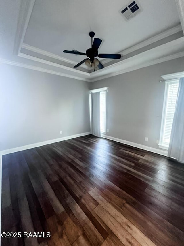 204 Red Cedar Ln, Youngsville, LA 70592 - empty room featuring a raised ceiling, dark wood-style floors, and visible vents