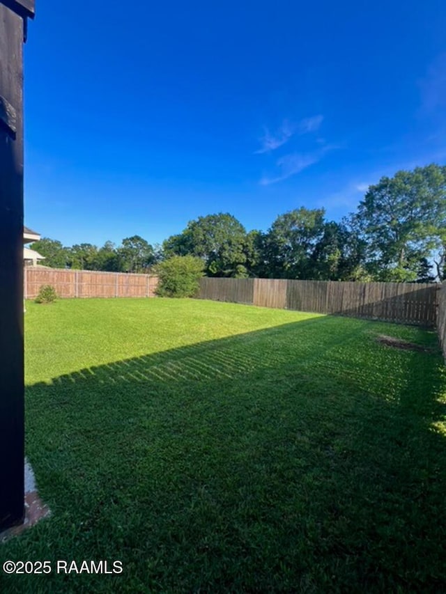 204 Red Cedar Ln, Youngsville, LA 70592 - view of yard with a fenced backyard