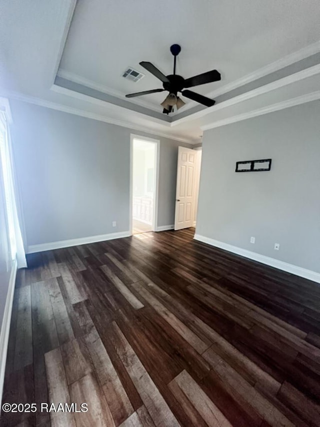 204 Red Cedar Ln, Youngsville, LA 70592 - unfurnished room with visible vents, a raised ceiling, baseboards, and dark wood finished floors