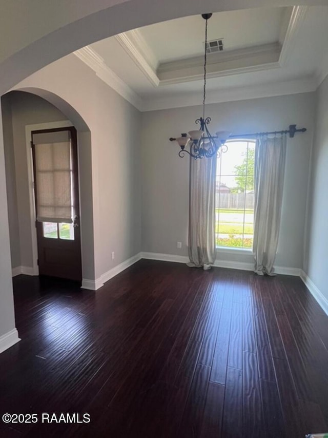204 Red Cedar Ln, Youngsville, LA 70592 - unfurnished dining area featuring a healthy amount of sunlight, an inviting chandelier, and a tray ceiling