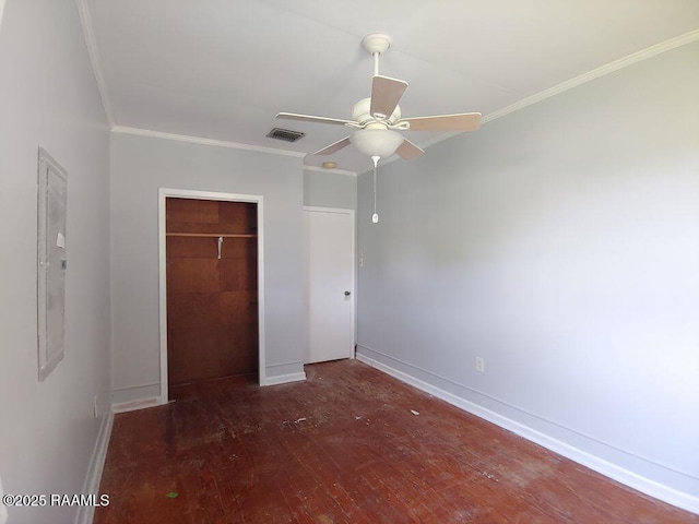 unfurnished bedroom featuring visible vents, ornamental molding, hardwood / wood-style floors, and a closet