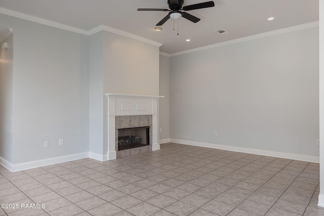unfurnished living room with a tiled fireplace, baseboards, ornamental molding, and a ceiling fan