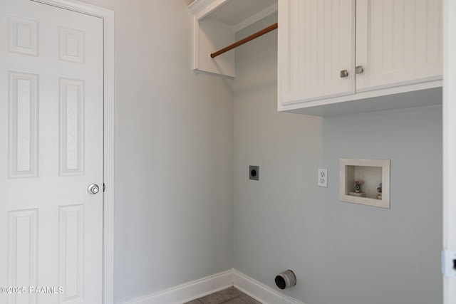 laundry room featuring electric dryer hookup, hookup for a washing machine, cabinet space, and baseboards