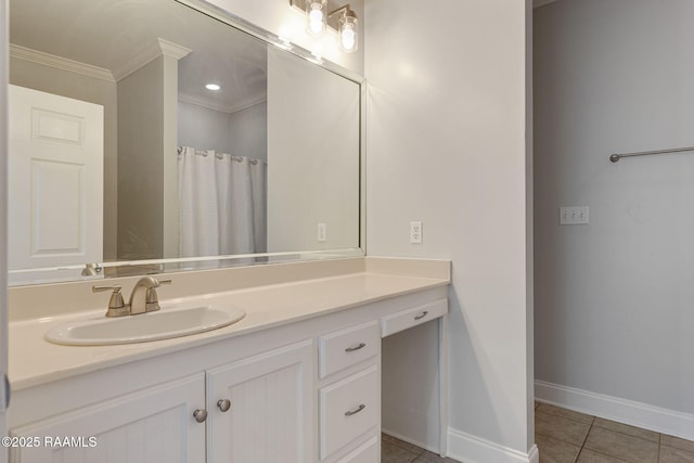 full bath featuring vanity, ornamental molding, baseboards, and tile patterned floors