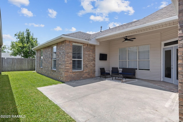 view of patio featuring fence and a ceiling fan