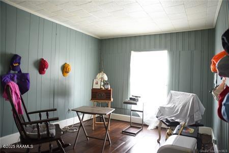 sitting room with a wealth of natural light and wood finished floors