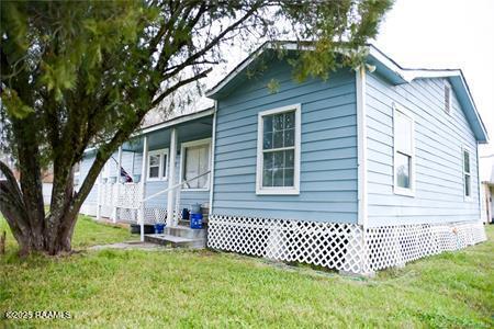 exterior space with a front lawn