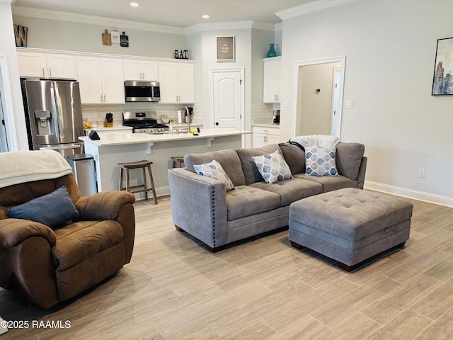 131 Wild Cherry Ln, Lafayette, LA 70508 - living room featuring recessed lighting, crown molding, baseboards, and light wood-style floors
