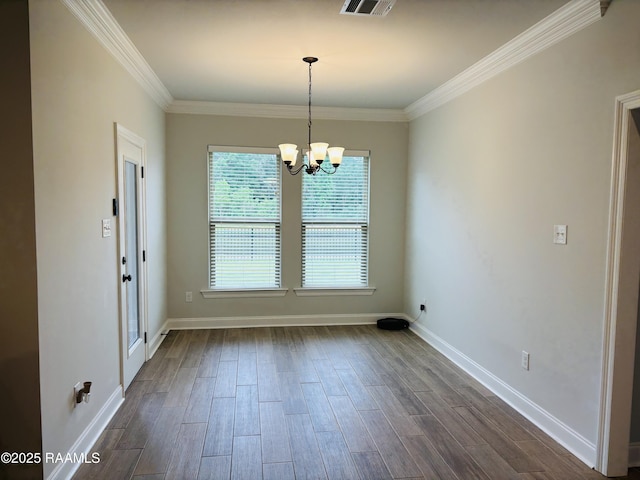 131 Wild Cherry Ln, Lafayette, LA 70508 - unfurnished dining area with dark wood-style flooring, a chandelier, ornamental molding, and baseboards