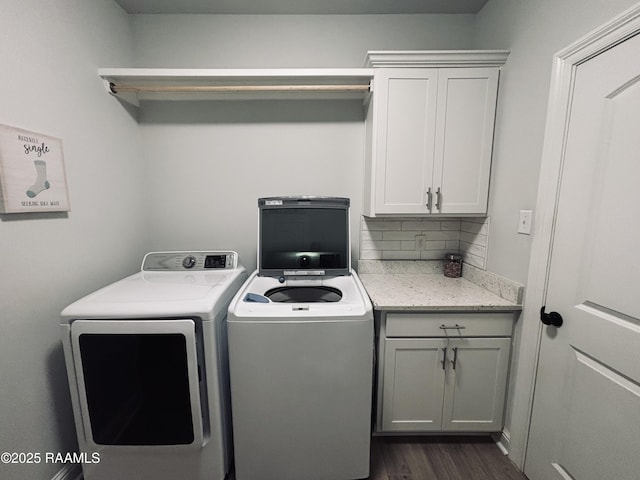 131 Wild Cherry Ln, Lafayette, LA 70508 - washroom featuring cabinet space, washer and dryer, and dark wood-type flooring