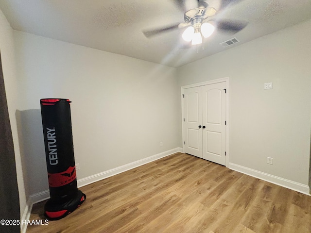 131 Wild Cherry Ln, Lafayette, LA 70508 - spare room featuring light wood finished floors, ceiling fan, and baseboards
