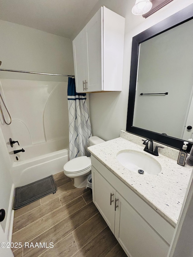 131 Wild Cherry Ln, Lafayette, LA 70508 - full bathroom featuring wood finished floors, toilet, shower / tub combo with curtain, and vanity