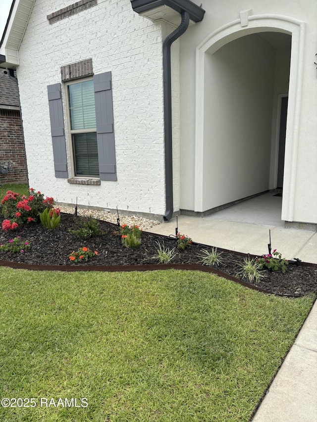131 Wild Cherry Ln, Lafayette, LA 70508 - view of side of home featuring stucco siding and a yard