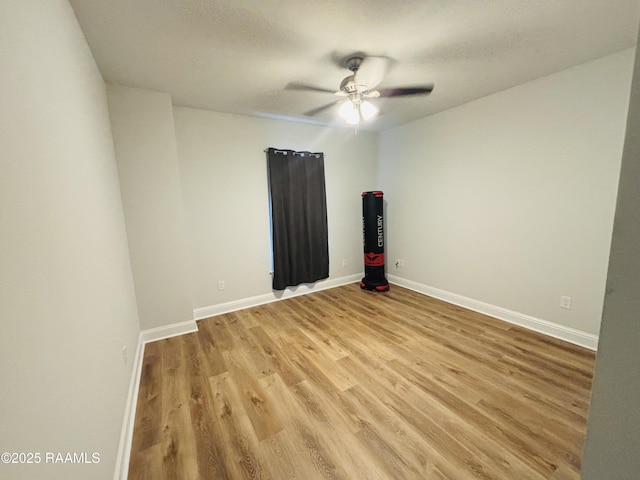 131 Wild Cherry Ln, Lafayette, LA 70508 - spare room with light wood-style floors, a ceiling fan, and baseboards