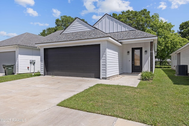 view of front of property with a garage, a shingled roof, driveway, a front lawn, and cooling unit