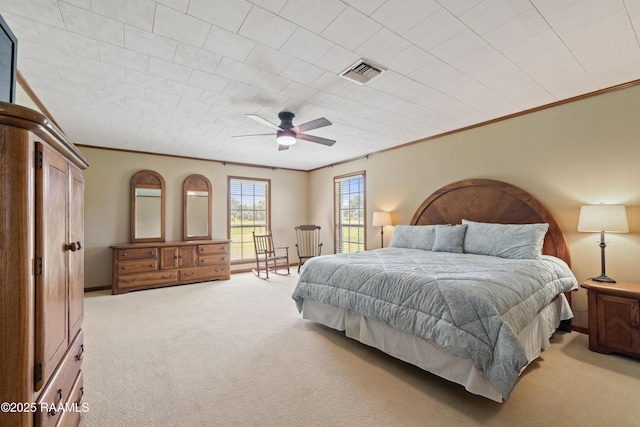 319 Roger Rd, Lafayette, LA 70507 - bedroom with light colored carpet, ornamental molding, and a ceiling fan