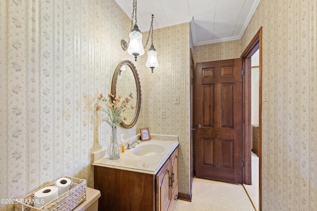 319 Roger Rd, Lafayette, LA 70507 - bathroom featuring wallpapered walls, vanity, crown molding, and a tub to relax in