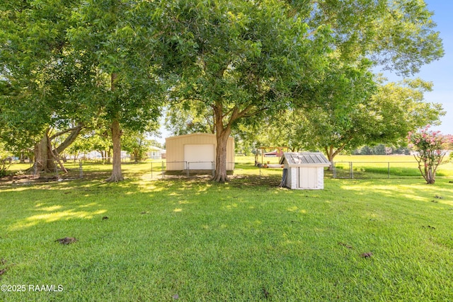 319 Roger Rd, Lafayette, LA 70507 - view of yard with a storage unit
