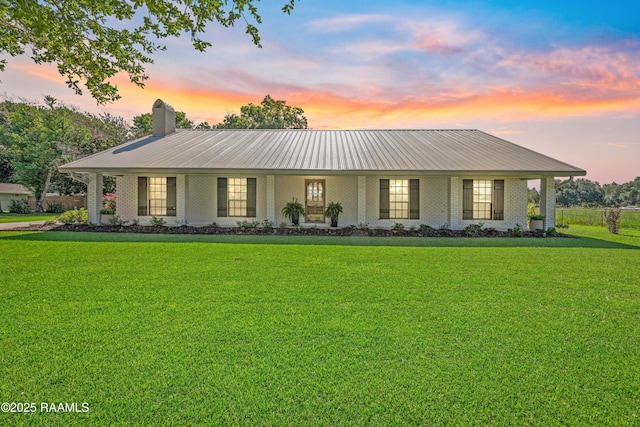 319 Roger Rd, Lafayette, LA 70507 - view of front of home featuring a chimney and a front lawn