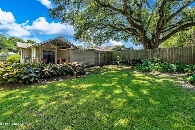 view of yard with a fenced backyard