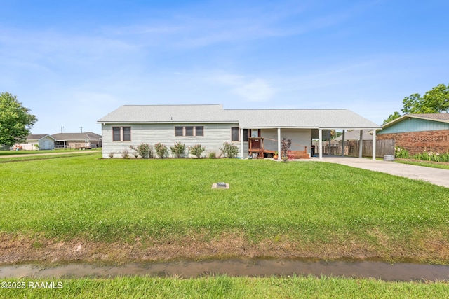 202 Sapphire Dr, Lafayette, LA 70506 - ranch-style home featuring driveway, a front yard, fence, and a carport