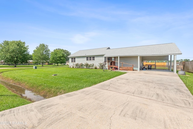 202 Sapphire Dr, Lafayette, LA 70506 - single story home with concrete driveway, fence, a front lawn, and an attached carport