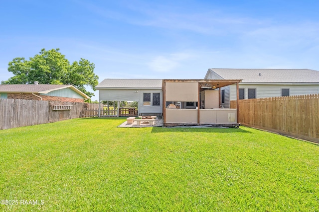 202 Sapphire Dr, Lafayette, LA 70506 - rear view of property with a fenced backyard, a patio area, and a lawn