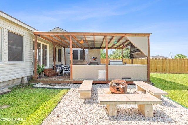 202 Sapphire Dr, Lafayette, LA 70506 - view of patio / terrace with a fire pit, fence, and a wooden deck