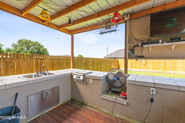 202 Sapphire Dr, Lafayette, LA 70506 - view of patio / terrace with an outdoor kitchen, grilling area, a sink, and a fenced backyard