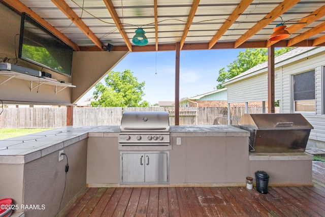 202 Sapphire Dr, Lafayette, LA 70506 - view of patio featuring a fenced backyard, area for grilling, and an outdoor kitchen