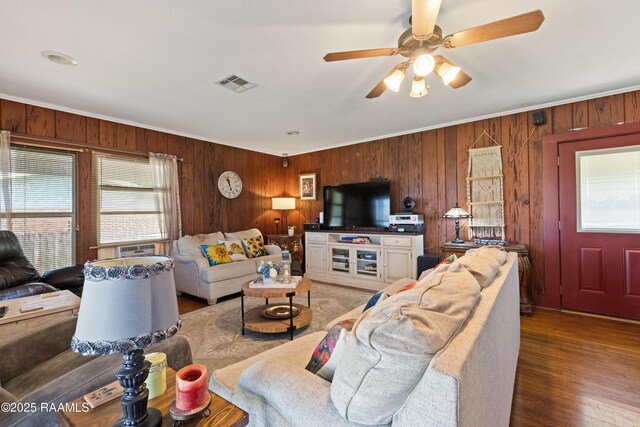 202 Sapphire Dr, Lafayette, LA 70506 - living room featuring ornamental molding, wood walls, a ceiling fan, and visible vents