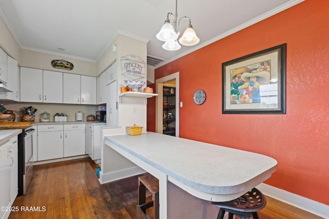 202 Sapphire Dr, Lafayette, LA 70506 - kitchen with a peninsula, dark wood-type flooring, a chandelier, light countertops, and stainless steel range with electric cooktop