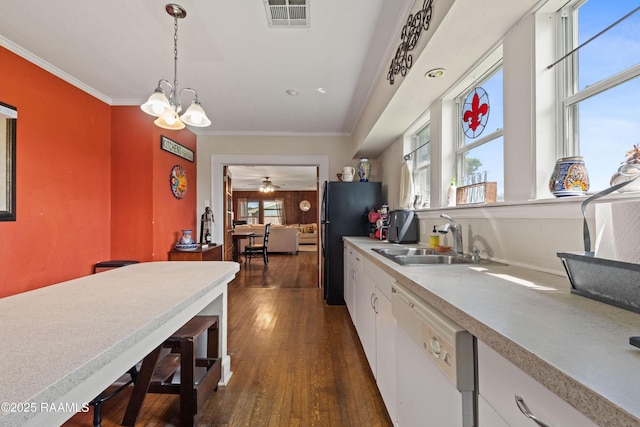 202 Sapphire Dr, Lafayette, LA 70506 - kitchen featuring a sink, freestanding refrigerator, dark wood-style floors, white dishwasher, and white cabinets