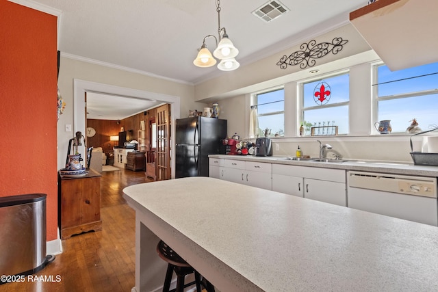 202 Sapphire Dr, Lafayette, LA 70506 - kitchen with freestanding refrigerator, dishwasher, ornamental molding, visible vents, and a sink