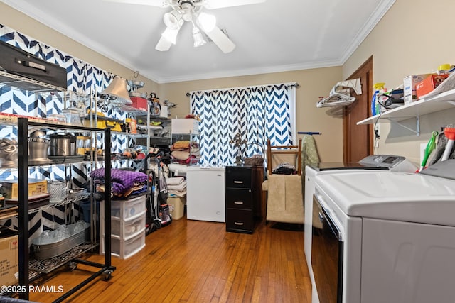 202 Sapphire Dr, Lafayette, LA 70506 - laundry room with ornamental molding, ceiling fan, washing machine and clothes dryer, hardwood / wood-style floors, and laundry area