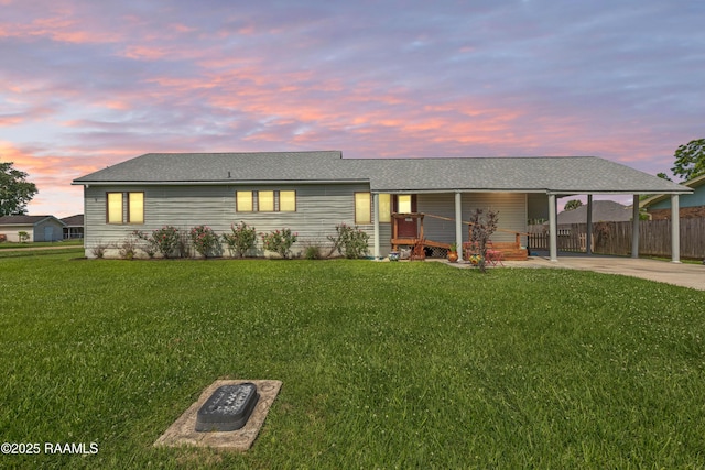 202 Sapphire Dr, Lafayette, LA 70506 - ranch-style house with fence, a carport, a front lawn, concrete driveway, and a shingled roof