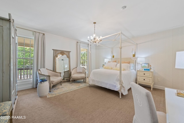 carpeted bedroom featuring a chandelier and ornamental molding