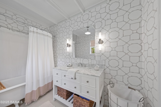 full bath featuring vanity and tile walls