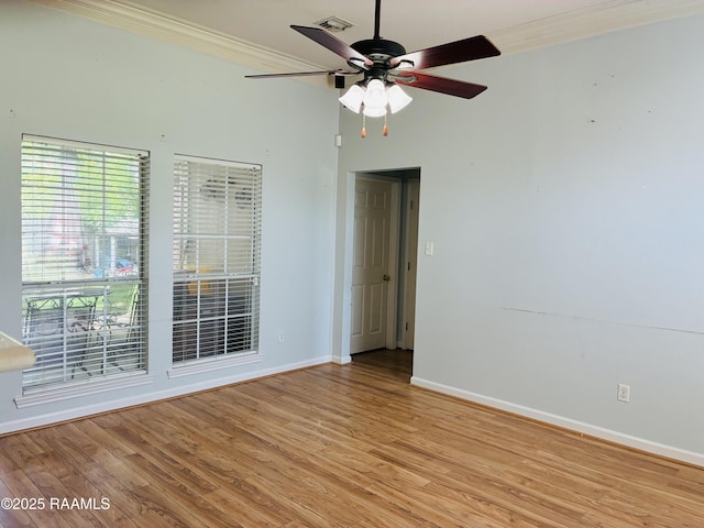 104 Bismark Dr, Broussard, LA 70518 - unfurnished room featuring crown molding, baseboards, a ceiling fan, plenty of natural light, and light wood finished floors