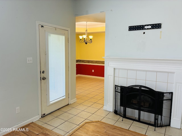 104 Bismark Dr, Broussard, LA 70518 - detailed view of a chandelier, baseboards, a tiled fireplace, and crown molding
