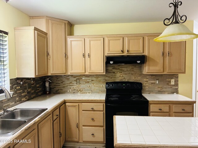 104 Bismark Dr, Broussard, LA 70518 - kitchen with tile countertops, a sink, black range with electric cooktop, under cabinet range hood, and light brown cabinetry