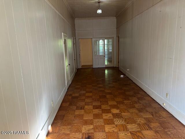 505 Fairview Ave, Abbeville, LA 70510 - corridor with a decorative wall, baseboards, and ornamental molding