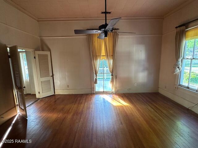 505 Fairview Ave, Abbeville, LA 70510 - spare room featuring crown molding, wood-type flooring, and a ceiling fan