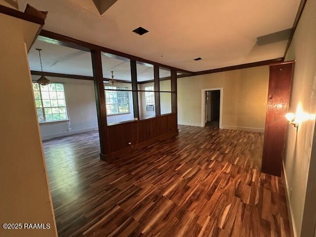 505 Fairview Ave, Abbeville, LA 70510 - unfurnished room featuring dark wood-style floors, baseboards, and crown molding