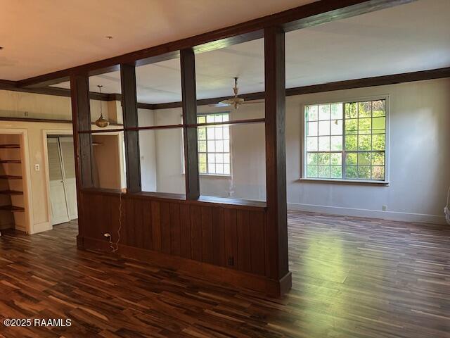 505 Fairview Ave, Abbeville, LA 70510 - spare room with dark wood-type flooring, baseboards, and ceiling fan